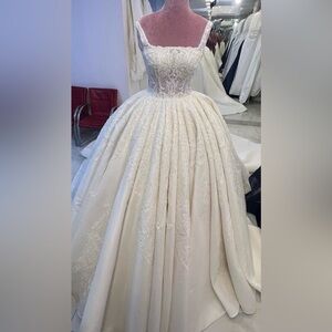 Seeking this beautiful beaded stain ball gown custom made with beaded veiled.